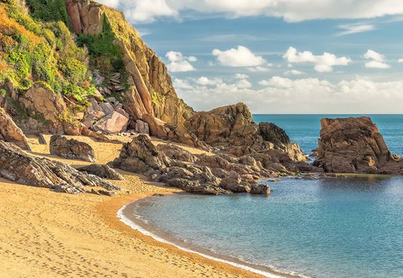 A view of the beach on a sunny day.